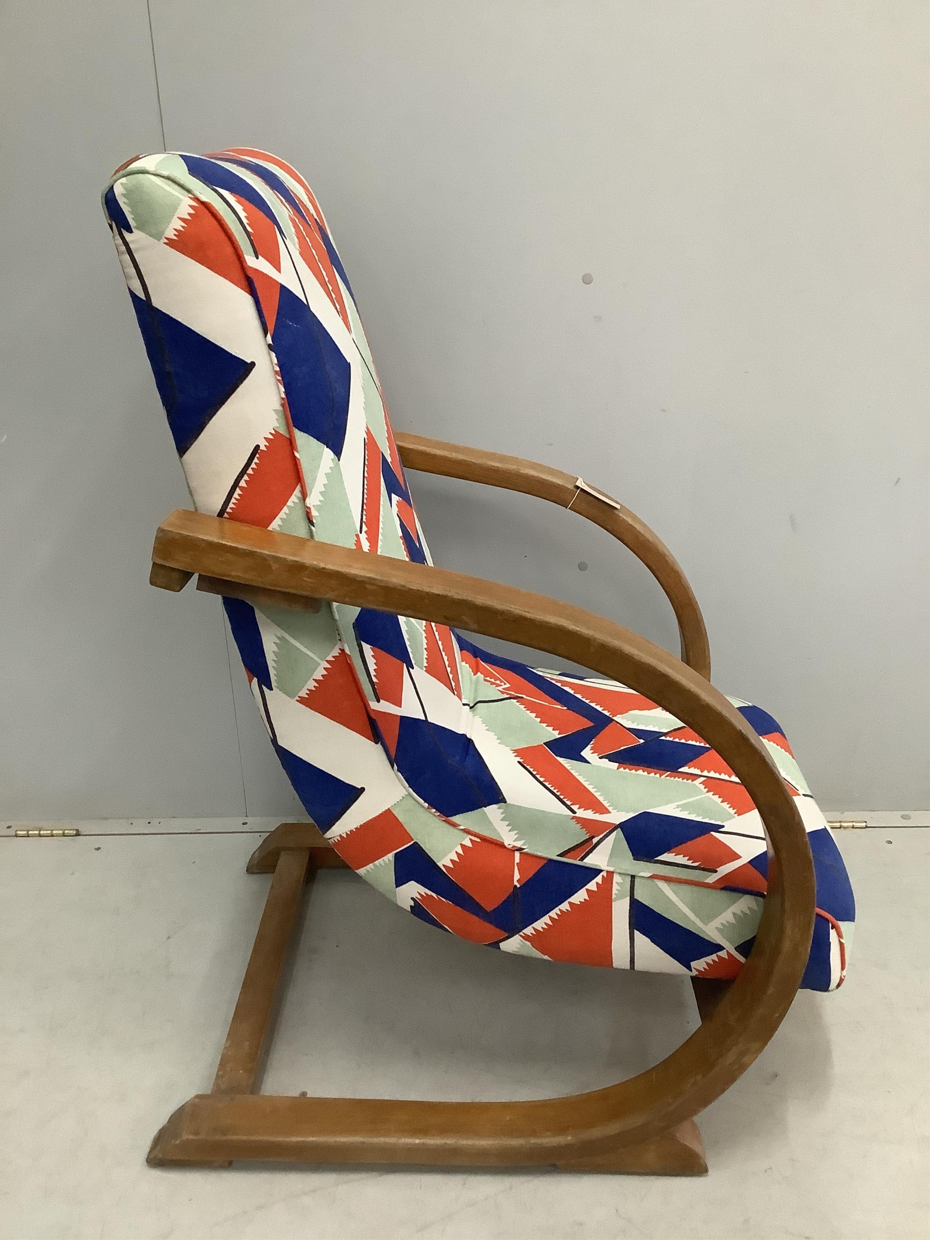 A mid century bentwood cantilever rocking chair, width 63cm, depth 80cm, height 102cm